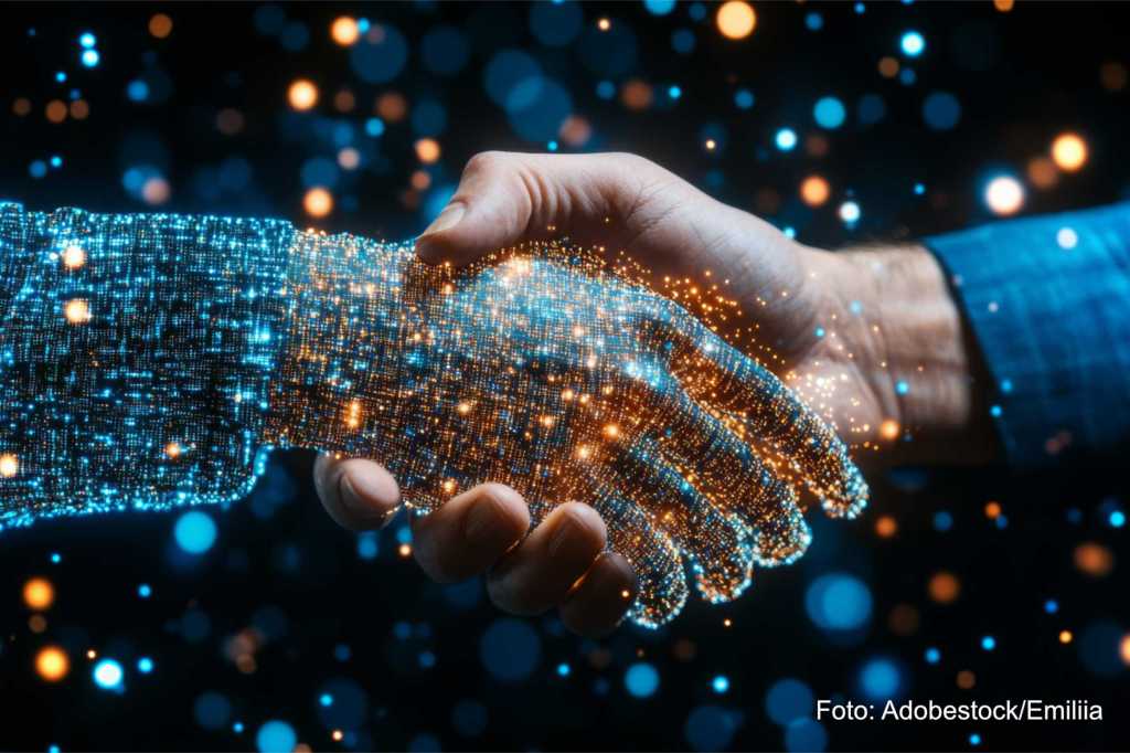 Eine digitasle Roboterhand, die KI darstellt, reicht einem Menschen die Hand.
